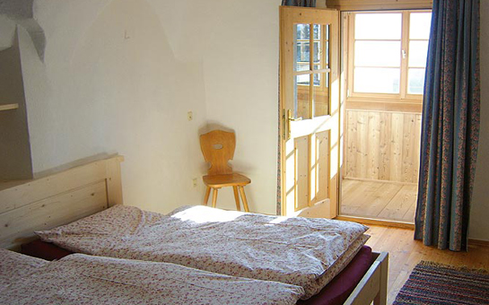 bed room and balcony with view of the Dolomites