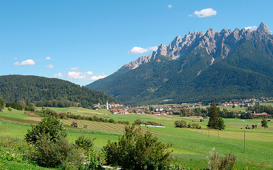 view of Toblach and the Dolomites in the summer