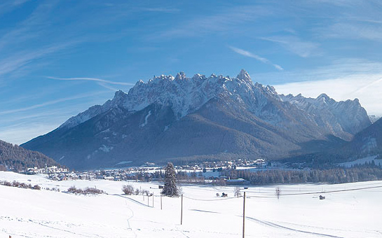 view of Toblach and the Dolomites in the winter